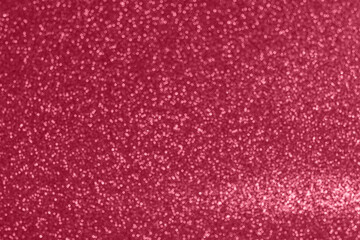 Abstract glow background with sparkle lights and bokeh. Useful as Christmas background or greeting card. 2023 Viva Magenta Colored Backdrop. Modern New Year Background. Creative toned Photo
