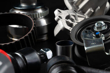Auto parts spare parts car on black background. Auto parts store. Suspension and engine parts.