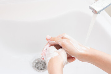 Washing of hands under running water. Hygiene concept.