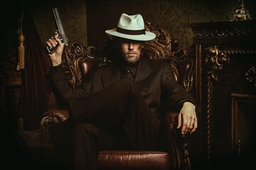mafia man with a gun - obrazy, fototapety, plakaty