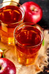 Apple juice in a glass on a napkin. 