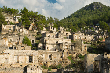 Fototapeta na wymiar Kayakoy village, abandoned ghost town near Fethiye - Turkey, ruins of stone houses. Site of the ancient Greek city of Karmilissos from the 18th century