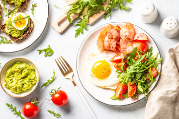 Healthy breakfast or lunch. Beacon, eggs and fresh salad.