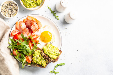 Healthy breakfast or lunch. Beacon, eggs and fresh salad.