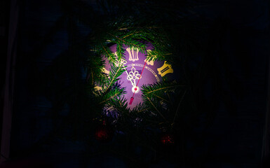 Clock with hands before the new year. The dial of the clock in the dark at 23.55.