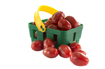 green shopping basket with red tomatoes