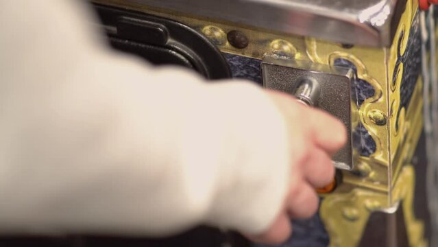 Starting a game on pinball arcade machine