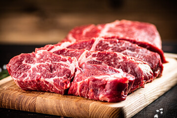 Chopped raw beef on a cutting board. 