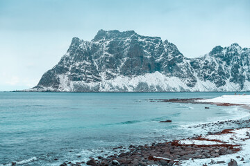 Uttakleiv beach during winter with amazing views on mountains, water, sea and ocean in Lofoten, Norway 
