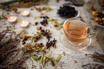 Still life with herbs and spices. Tea from dry medicinal herbs. A drink for health support and treatment. Home warm atmosphere