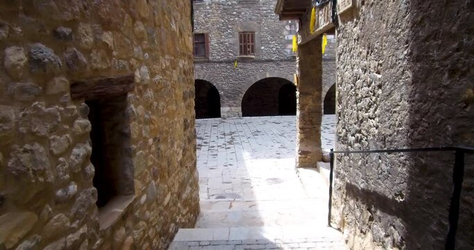 Stroll through the cobbled streets of a medieval village.Walking through the narrow and steep streets of BAG&Aacute;, a small mountain town located in the Pyrenees of Catalonia, Spain. Personal perspective.