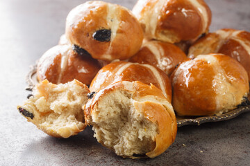 Homemade Hot Cross Buns Ready for Easter closeup on the plate on the table. Horizontal
