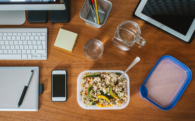 Barley salad lunchbox on a desk at office - 564271127