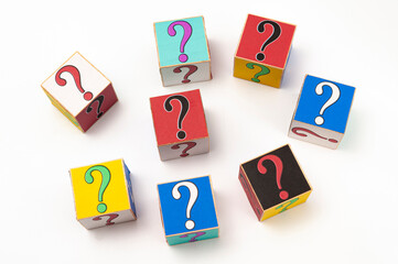 Question mark written on wooden blocks isolated on white background in top view