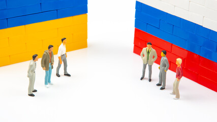 Miniature people. National Ukrainian and Russian flag from colored blocks constructor. The problem...