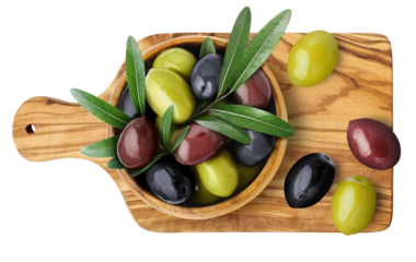 Green, black and brown olives with leaves on wooden board, cut out