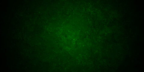 Dark green background with grunge backdrop texture, watercolor painted mottled green background, colorful bright ink and watercolor textures on black paper background.