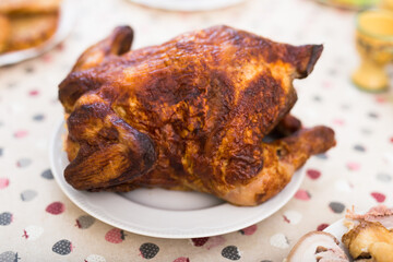 whole roasted chicken on a plate