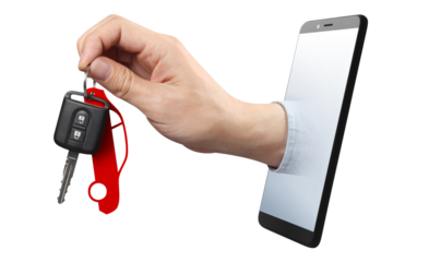 Hand holding a car key, sticking out of the smartphone screen, cut out