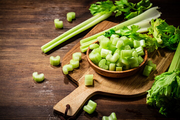 Sliced fresh celery on a cutting board. 