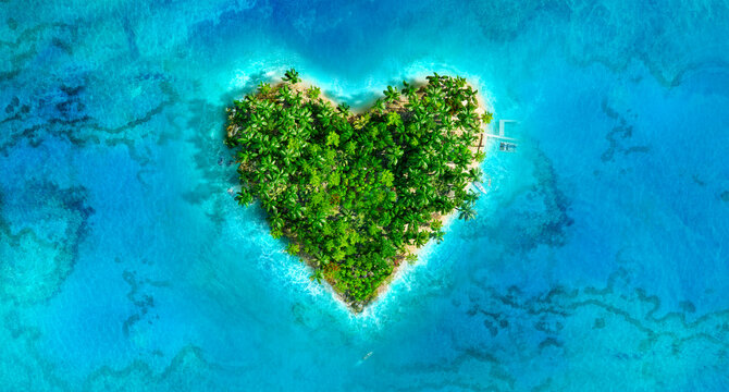 Valentine's day tropical love island. Heart shaped valentine island aerial view: palm trees, coral reefs, turquoise sea waves. Valentines day, wedding trip, honeymoon romantic paradise 3D greeting