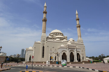 Fototapeta na wymiar Sharjah, United Arab Emirates - 01.05.2022 : The Sharjah Mosque, the largest mosque in the Emirate of Sharjah, the United Arab Emirates.