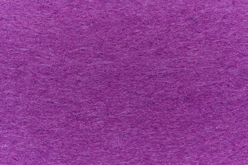 Soft felt textile material royal purple colors, colorful texture flap fabric background closeup