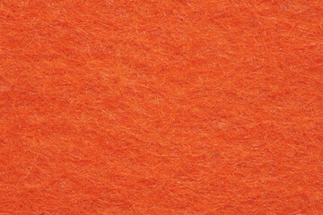 Soft felt textile material bright orange colors, colorful texture flap fabric background closeup