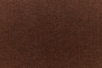 Soft felt textile material brown colors, colorful texture flap fabric background closeup