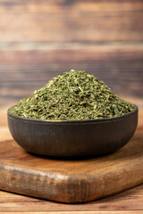 Dried mint spice. Dried mint leaves in bowl on rustic table. Dry spice concept