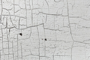 Texture of a gray painted surface in cracks.