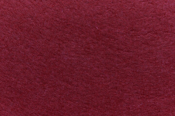Soft felt textile material red pink colors, colorful texture flap fabric background closeup