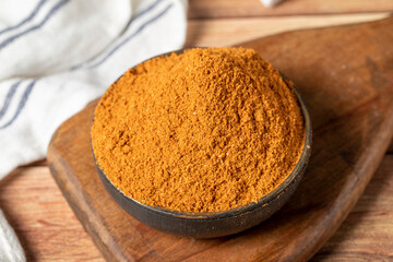 Meatball spice in bowl on rustic table. Meatball seasoning is a spice mix consisting of cumin, coriander, ground red pepper, thyme, black pepper, onion, garlic and dried parsley. Dry spice concept