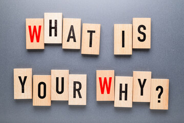 What is Your Why? by alphabets wood blocks on gray background, existence of personal life,...