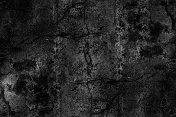 Dark grunge textured rough surface of old plaster wall with crack