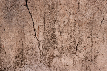 Cracked old concrete plaster wall surface with grunge texture