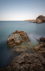 View of seascapes in long exposure technique, silky water and moving clouds with dynamic movement idea 