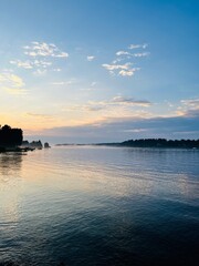 Tender fog at the lake, bright blue and purple sky, natural misty lake background