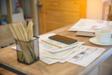 Business executive home office Desk Background concept. Business computer empty home office table with 1040 tax form, smartphone, desktop laptop, annual, summary report, document, and paper