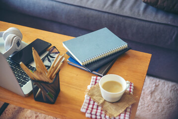 Business executive home office Desk Background concept. Business computer empty home office table with desktop laptop, notebook, smartphone, diary book, cup of coffee, pencil, document, and glasses.