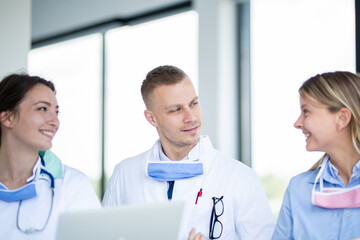 Health workers smiling and looking at the doctor