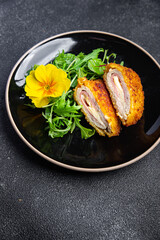 cutlet cordon bleu chicken meat, cheese, bacon healthy meal food snack on the table copy space food background rustic top view