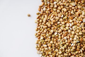 organic raw green buckwheat on a white background