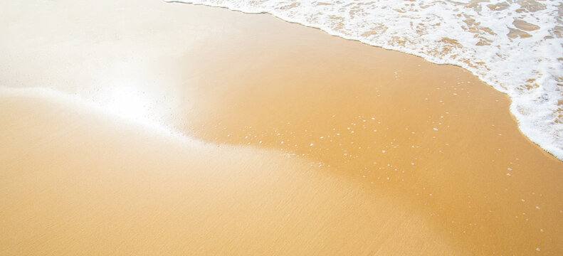 Beach sand and wave, nature background with copy space
