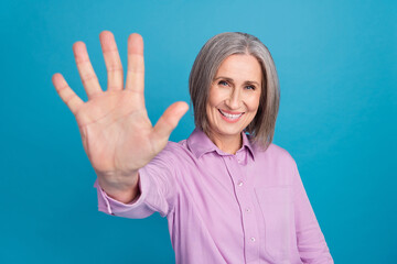 Photo of positive satisfied businesswoman cheerful working manager purple shirt showing palm five...