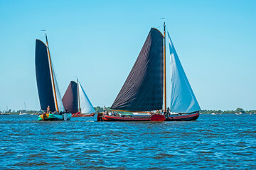 Traditional Frisian wooden sailing ships in a yearly competition in the Netherlands