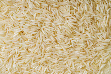 raw basmati rice on a white acrylic background