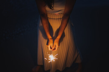 Anonymous woman with Bengal light