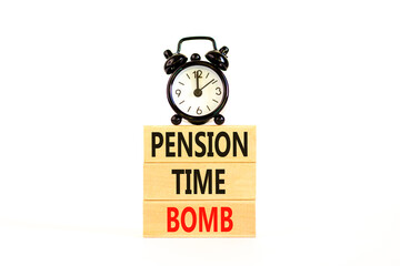 Pension time bomb symbol. Concept words Pension time bomb on wooden blocks on a beautiful white table white background. Black alarm clock. Business pension time bomb concept. Copy space.