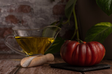 Agriculture and healthy eating, Moorish tomatoes from the garden with jar of oil and salt